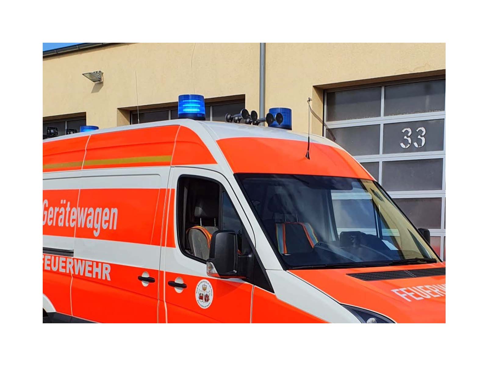 B2 Rhodon Max Basic Blue In Situ Two Beacons Lit, 1 Unlit on top of Fire Vehicle