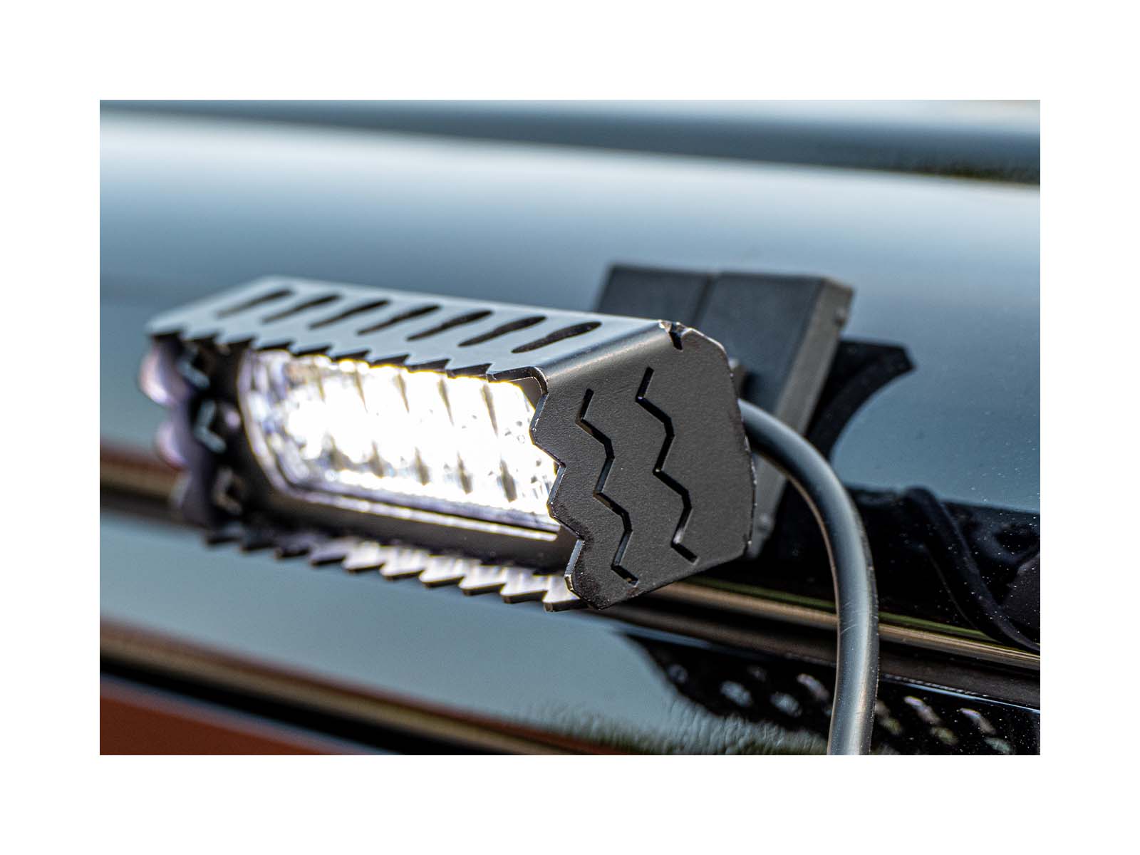 L52 Hand-Held Searchlight Lit In Situ On Vehicle at Night Close Up 2