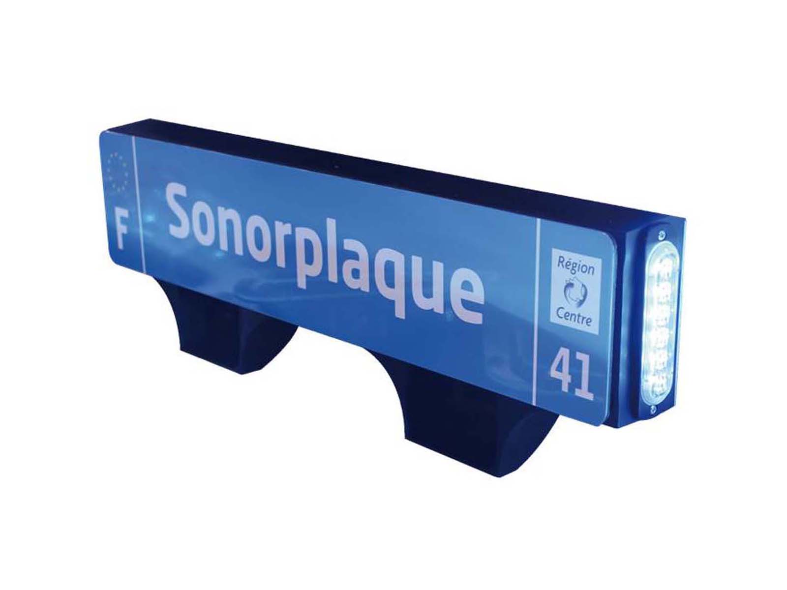 Siren and speaker unit built into the number plate